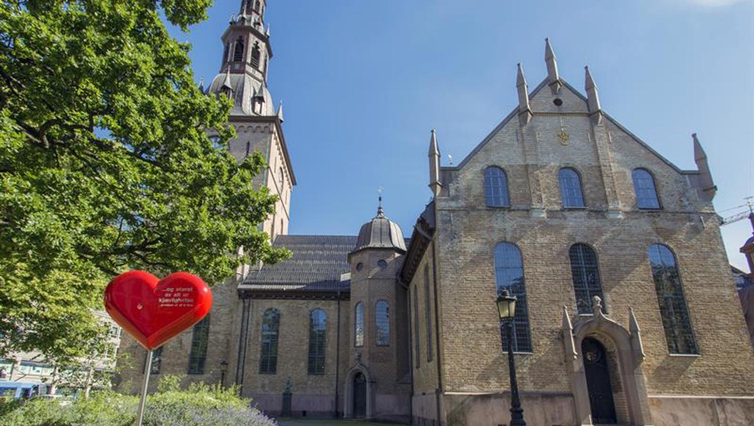 oslo cathedral with statue and tree in front