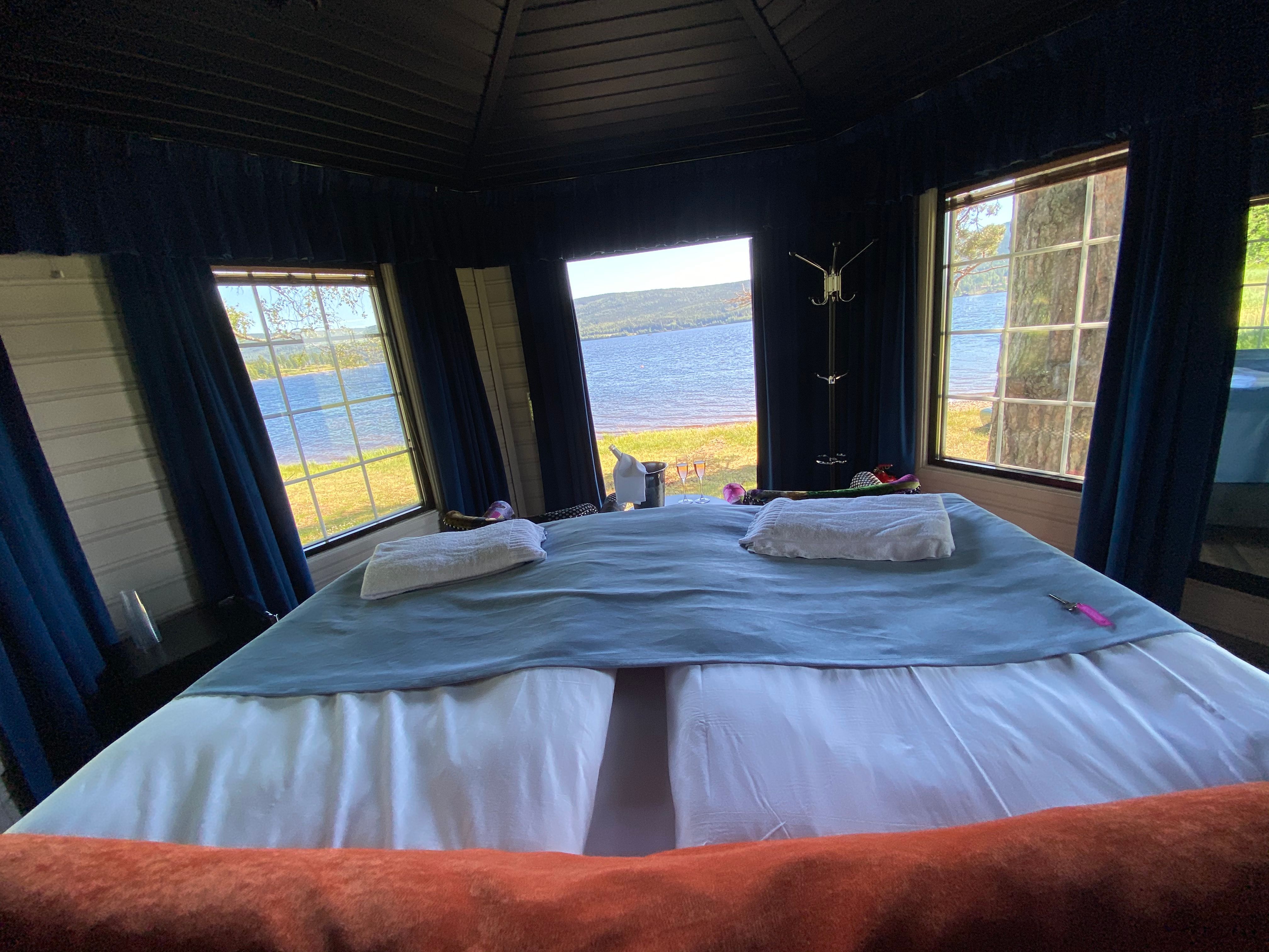 Bed with a view to a lake
