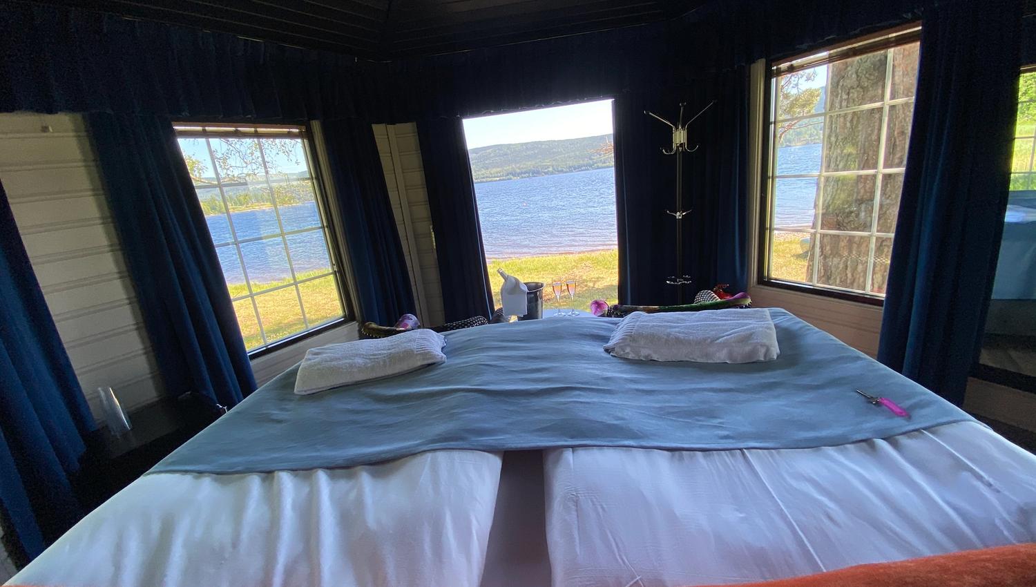 Bed with a view to a lake