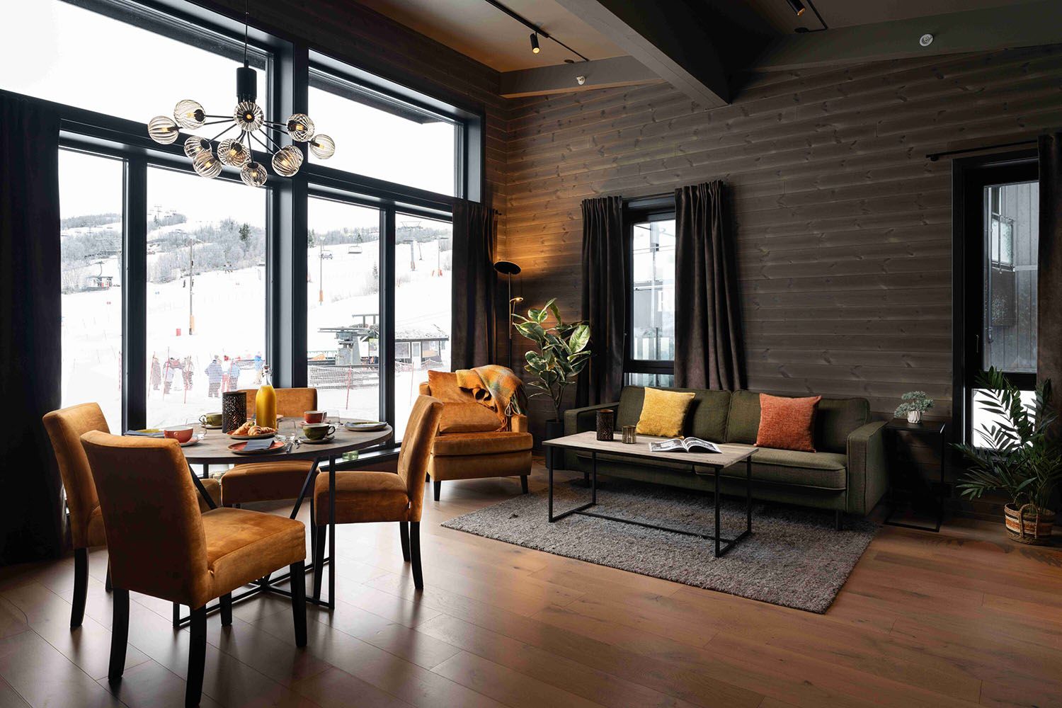 Hotel suite in warm colours with view to ski lift