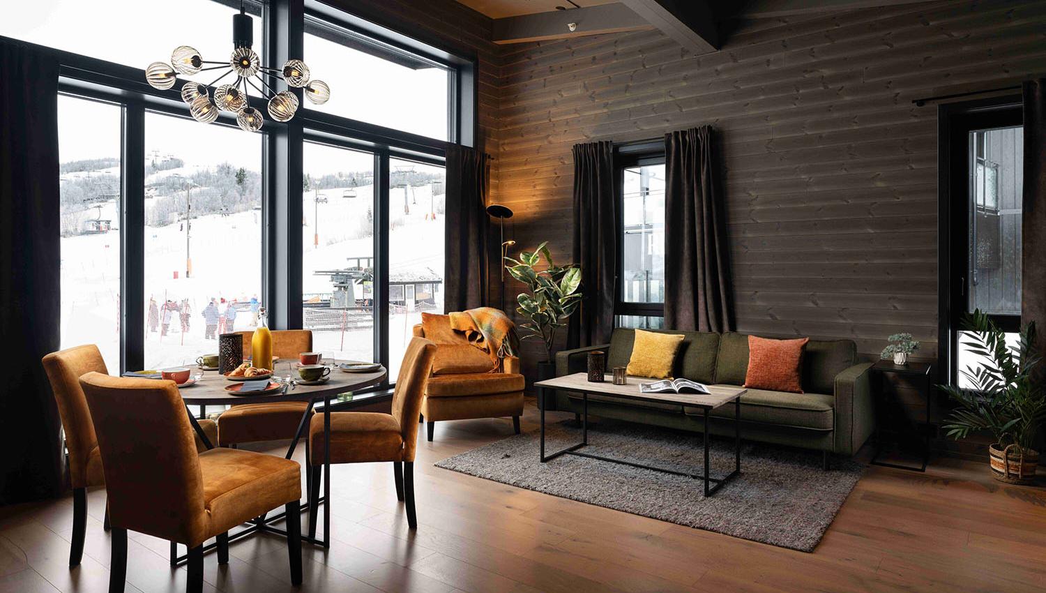 Hotel suite in warm colours with view to ski lift