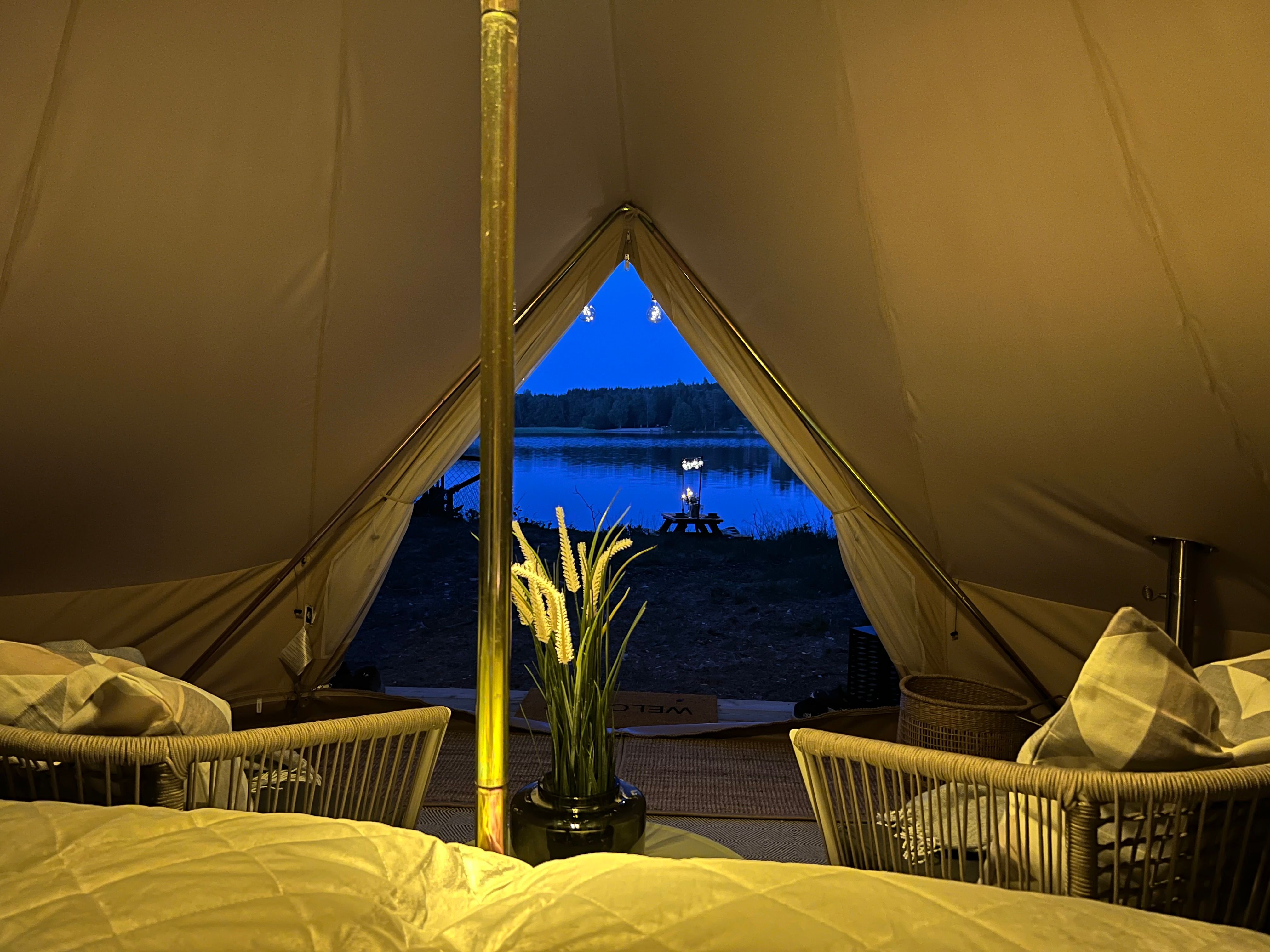 Evening atmosphere with a picture taken from inside the tent and out to the lake which is right outside - Lyseren
