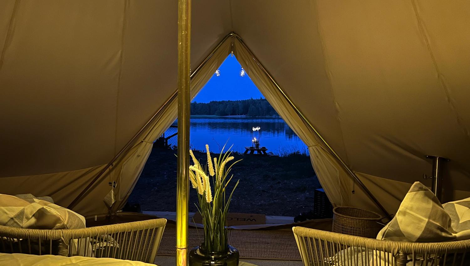 Evening atmosphere with a picture taken from inside the tent and out to the lake which is right outside - Lyseren