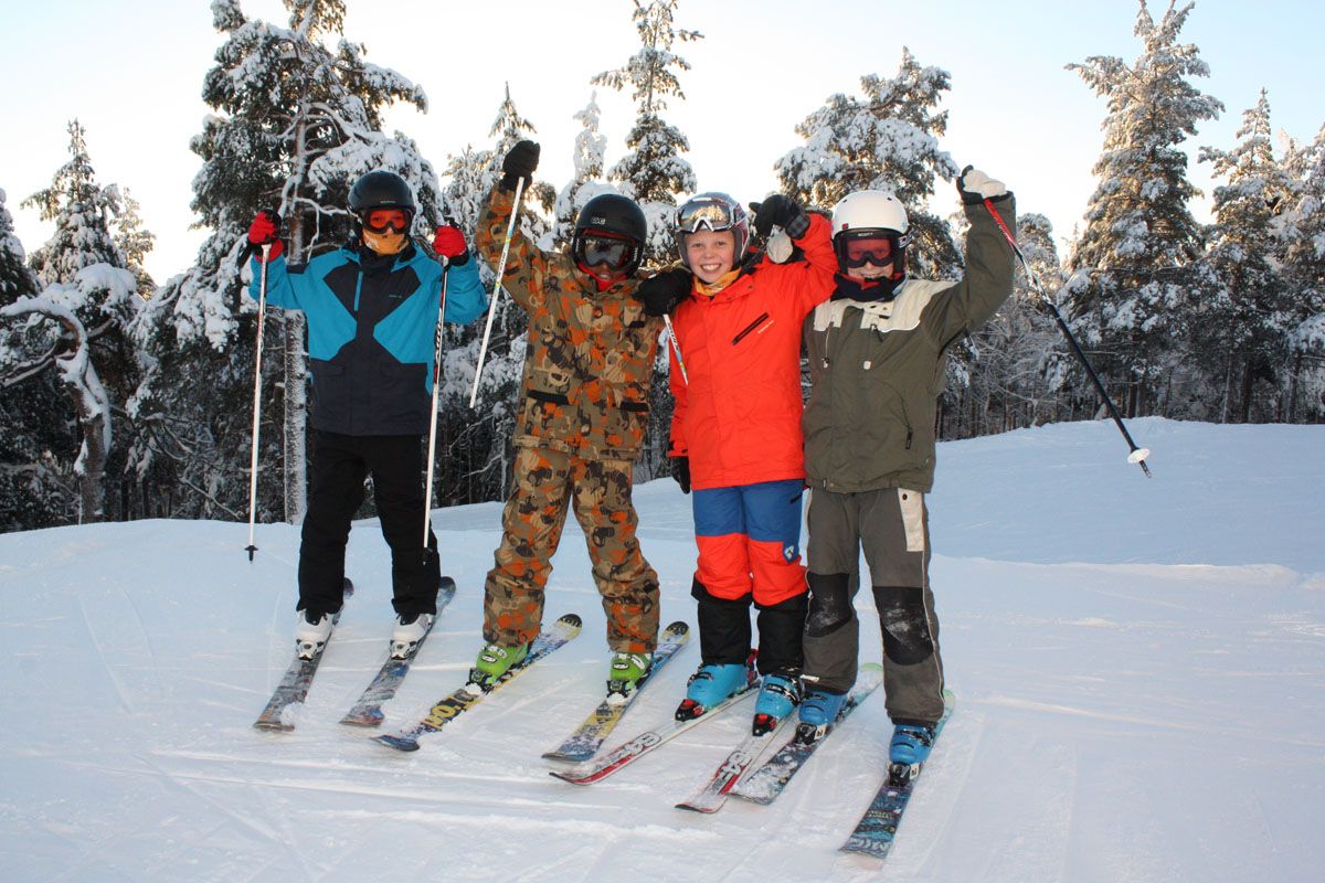 a group of children in ski clothing