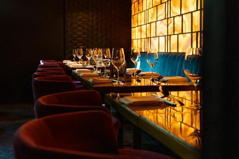 Tables set for dining and chairs