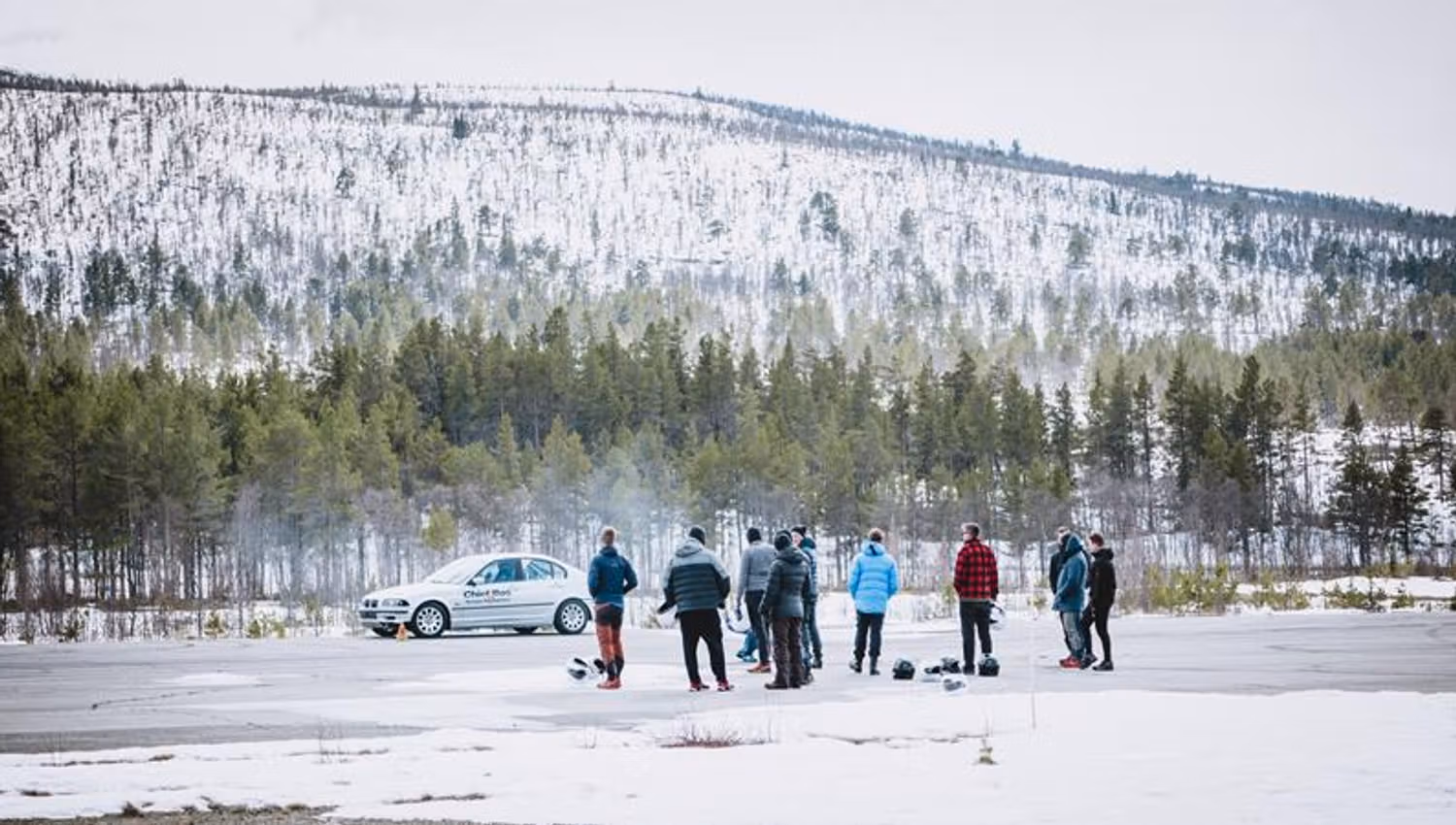A group of spectators are eagerly following the rally.