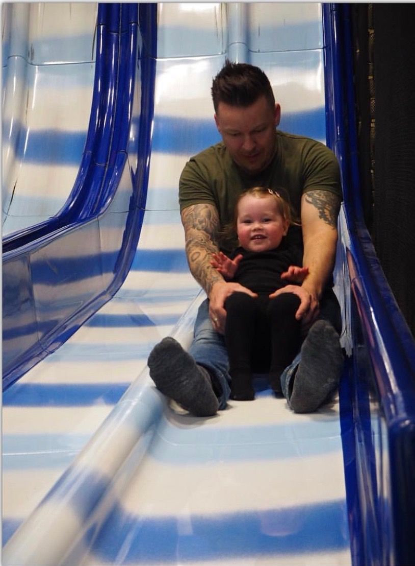 Child and father in slide