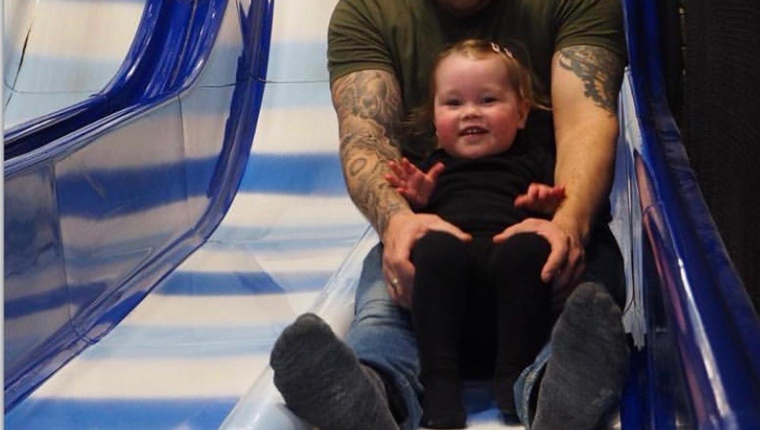 Child and father in slide
