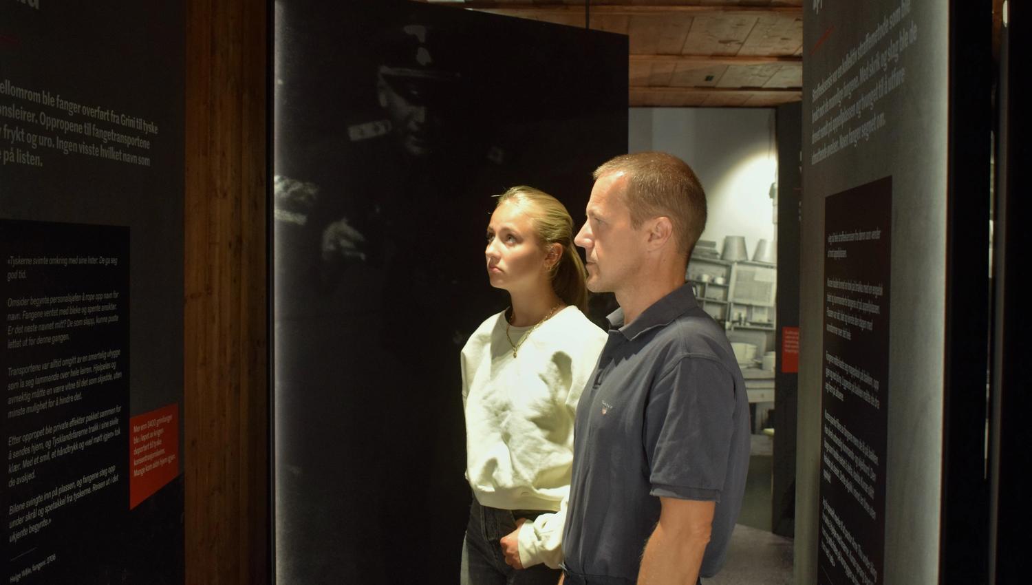 Girl and man in the exhibition