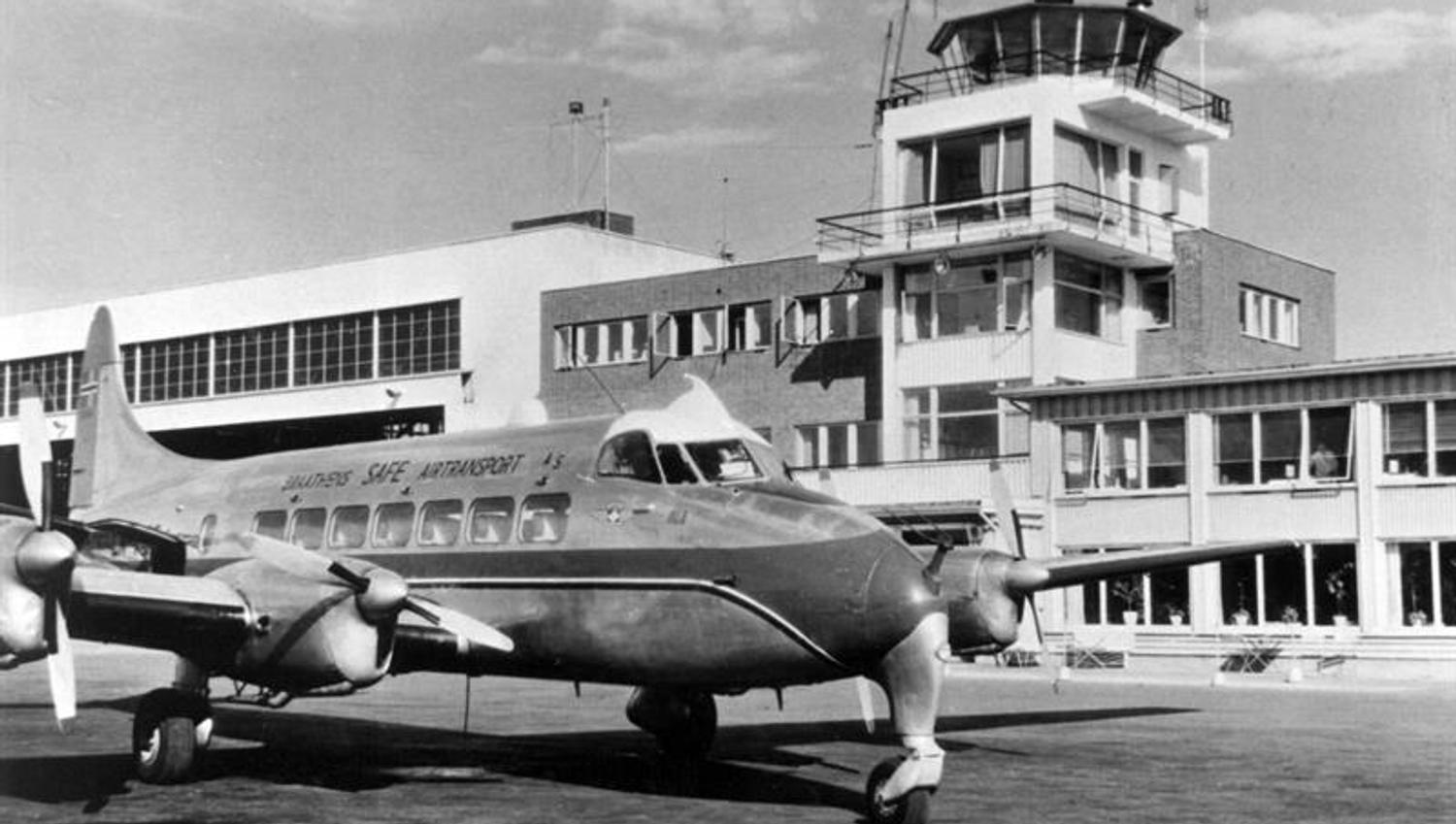 Airplane outside flight tower