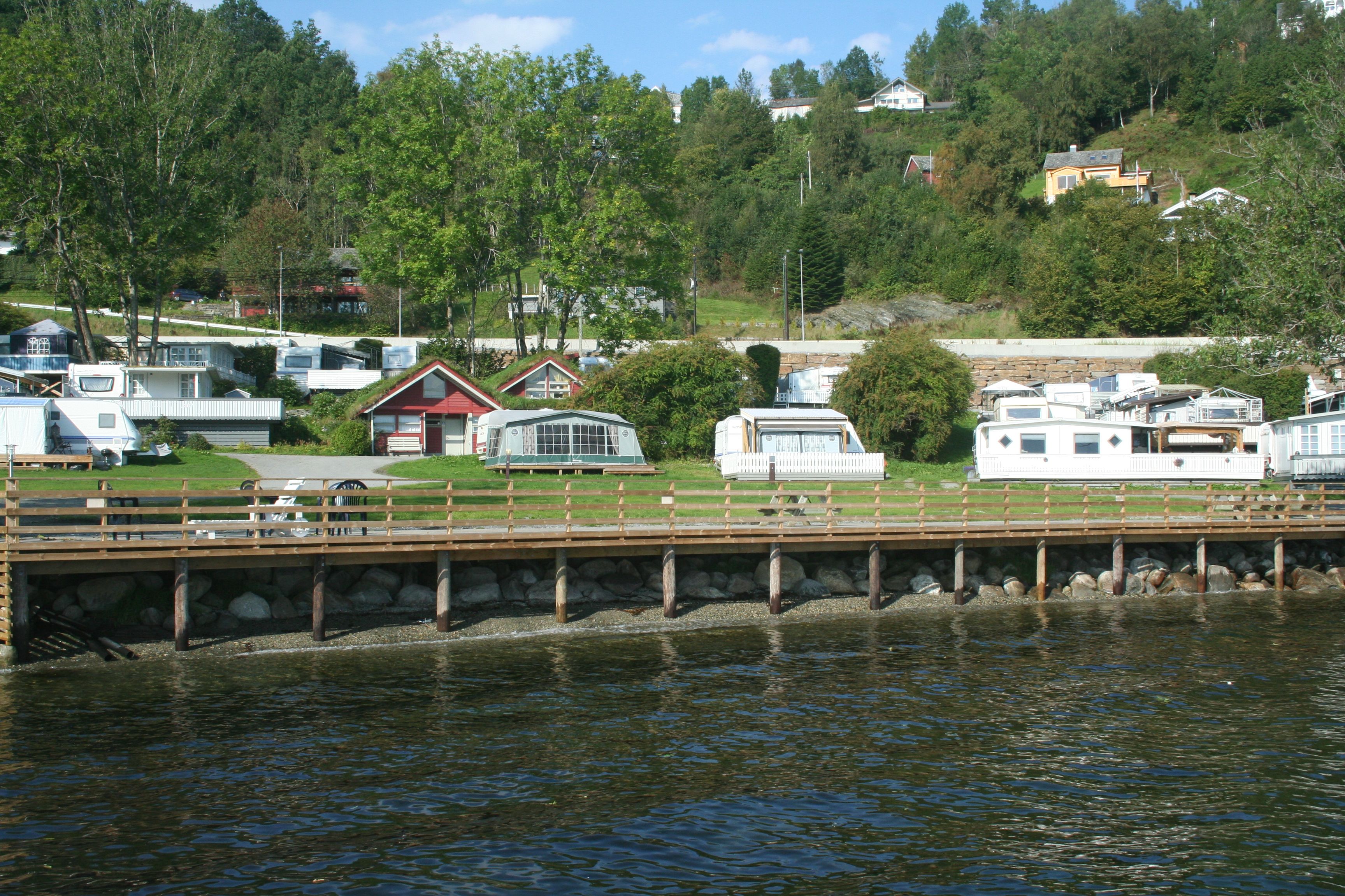 Caravan and cabin area along the waterfront at Hardanger Feriesenter.