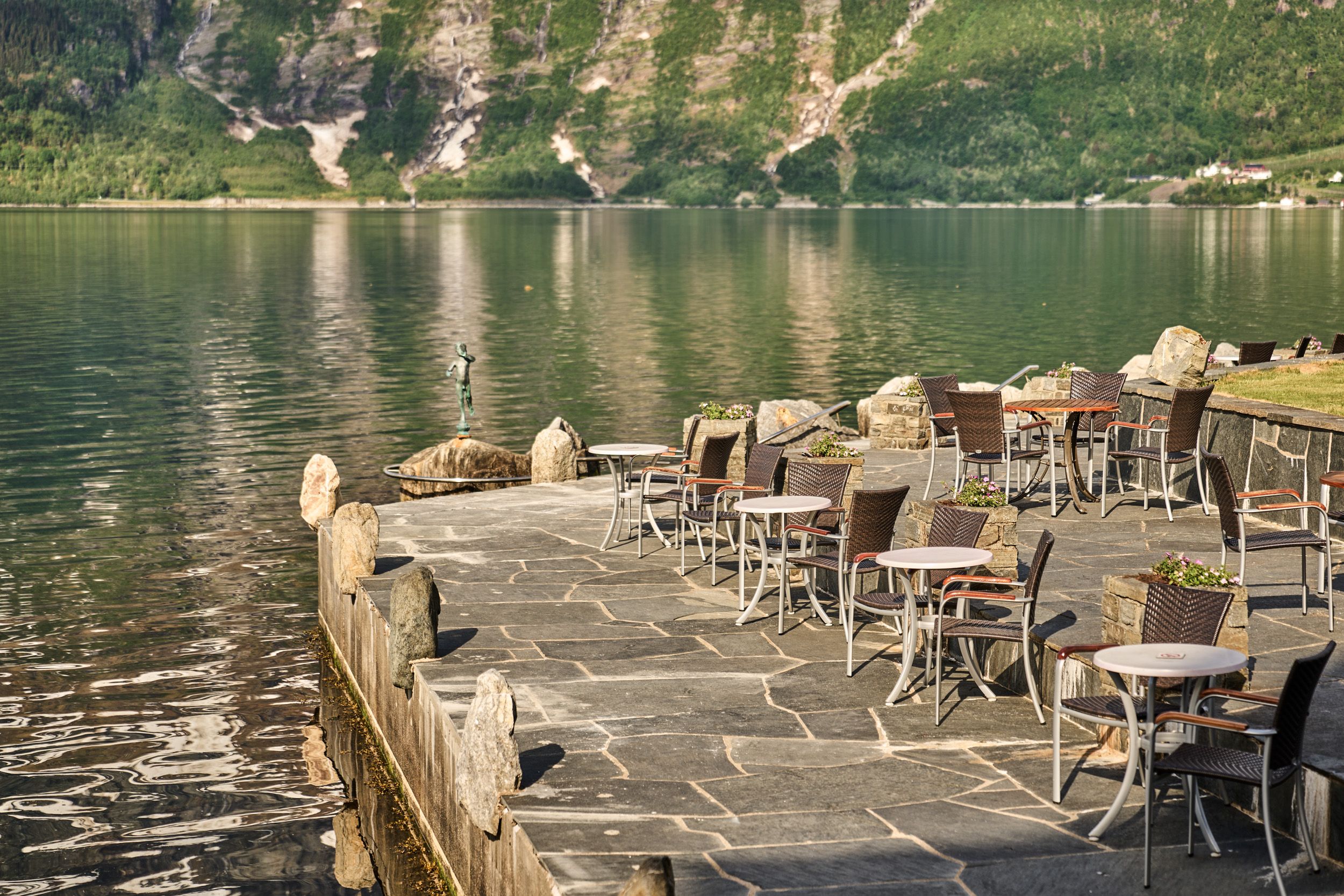 Charming fjordside terrace, ideal for a coffee break with panoramic views of the Hardangerfjord.