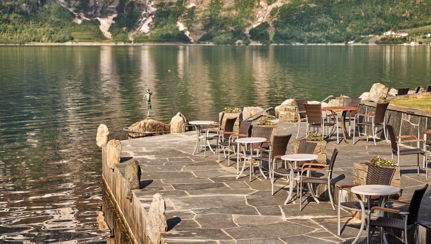 Charming fjordside terrace, ideal for a coffee break with panoramic views of the Hardangerfjord.