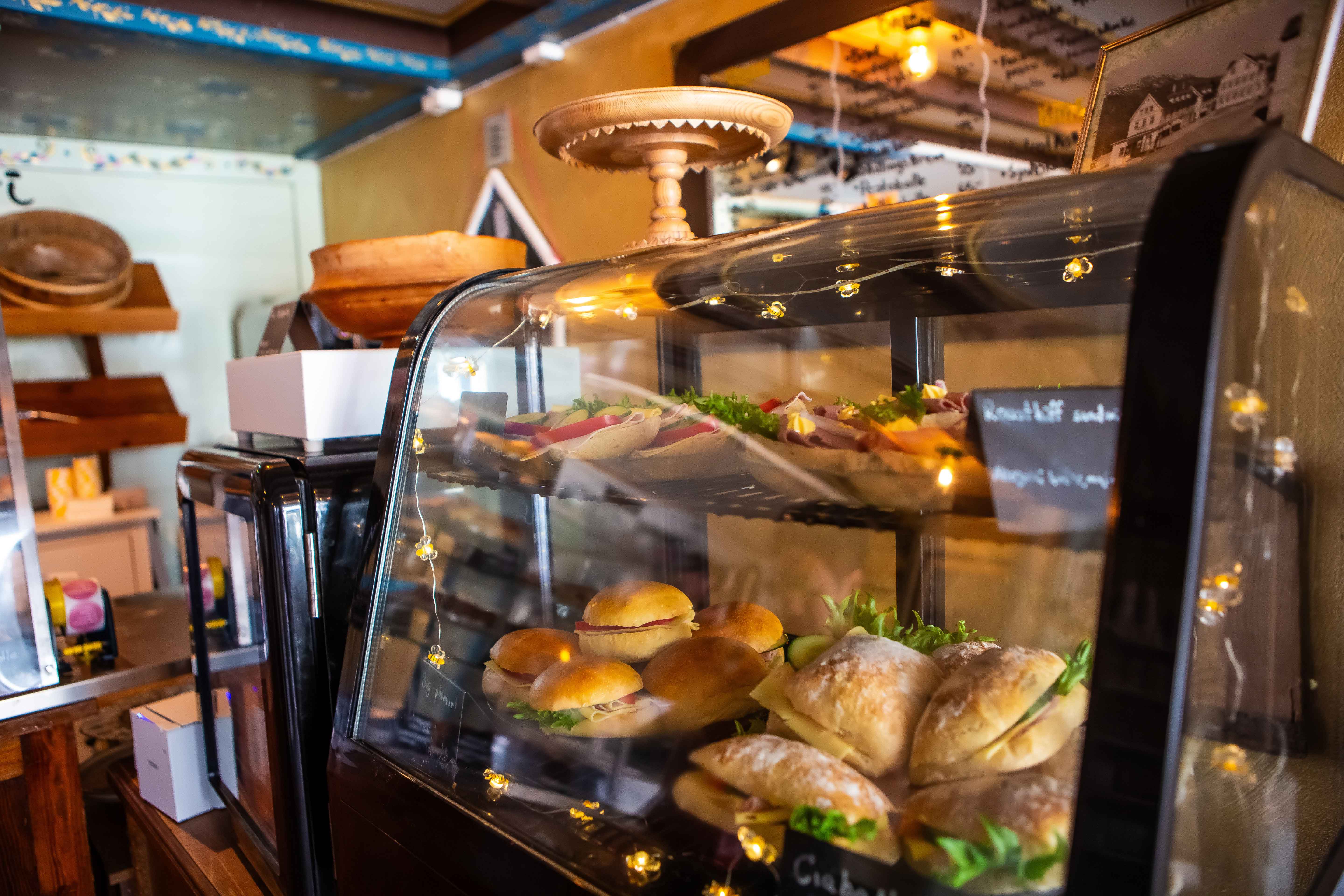 Fresh baked goods behind the counter at the charming Fløy Bakery in Lofthus.