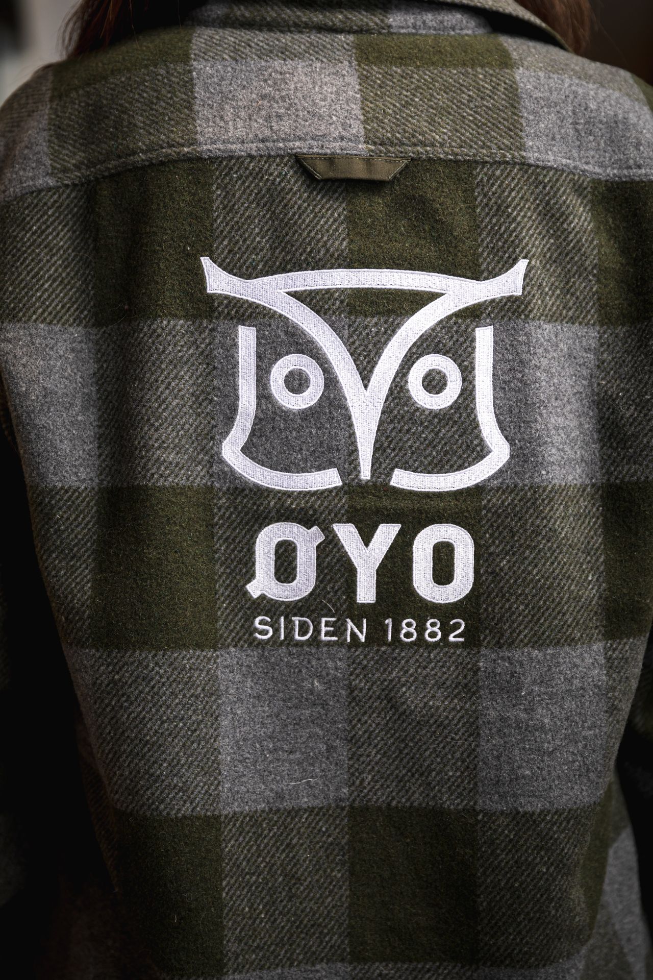 Øyo owl logo on workwear.