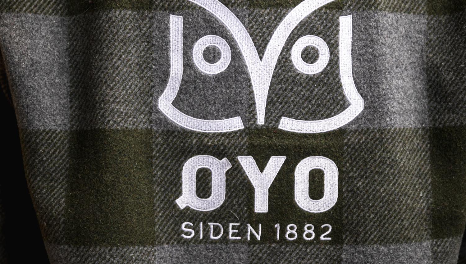 Øyo owl logo on workwear.