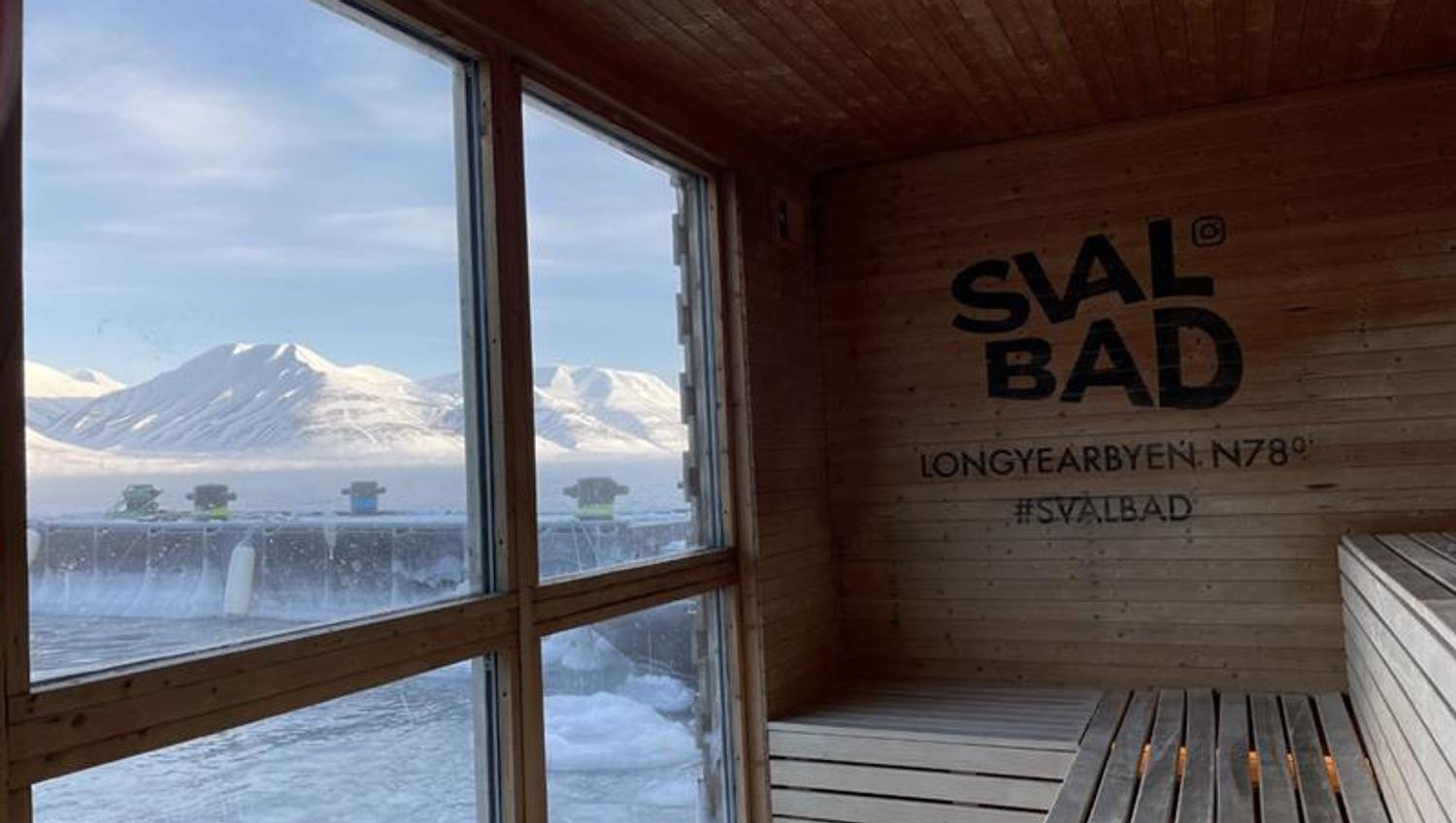 The view towards mountainous landscapes and a fjord from the interior of the sauna