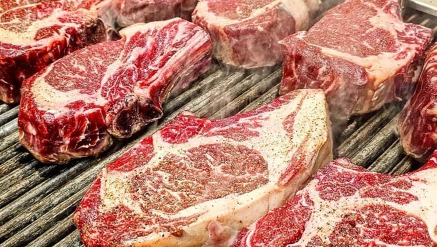 Ribeye steaks on the grill