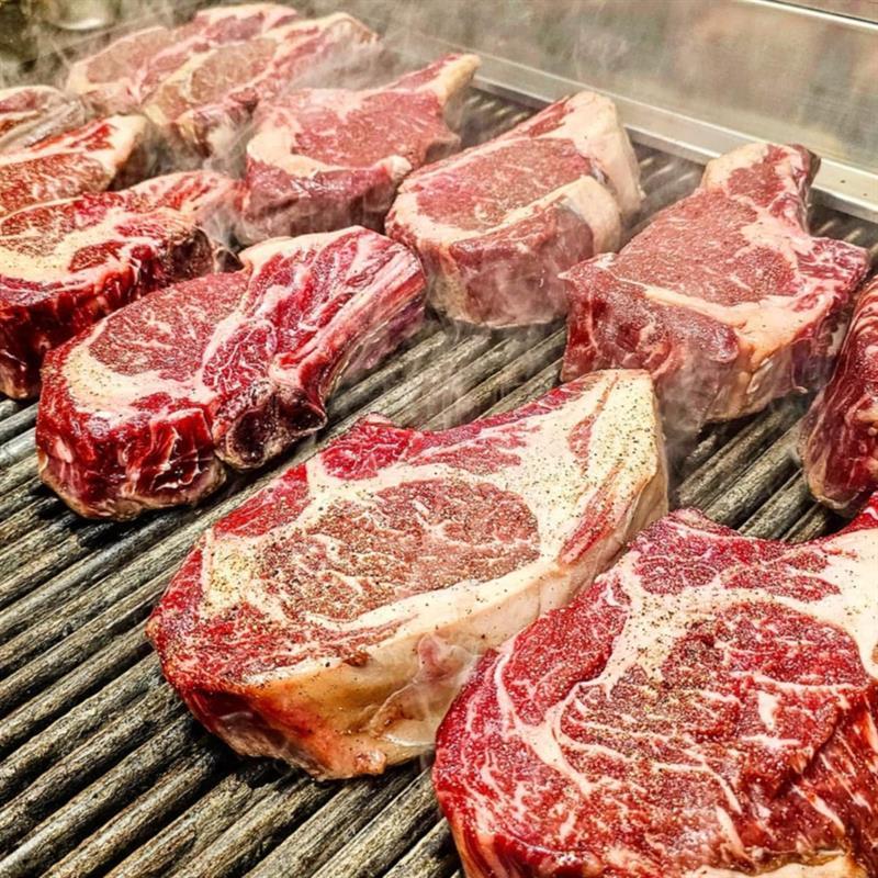 Ribeye steaks on the grill