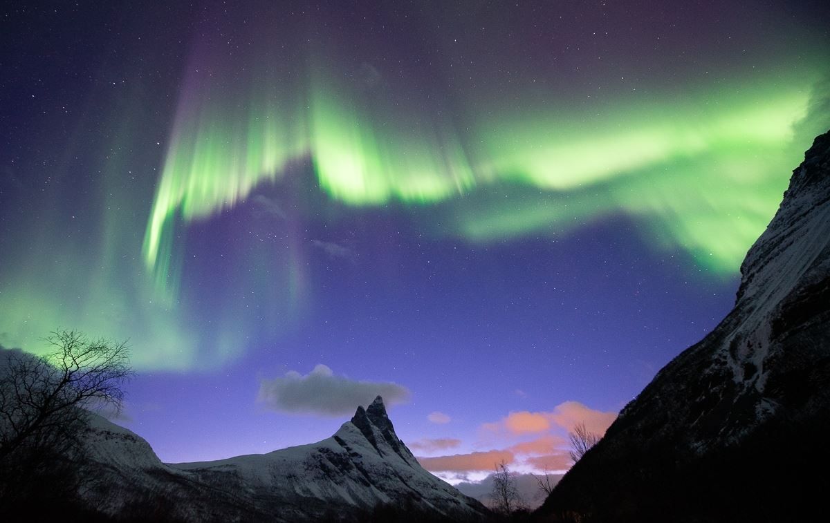 Northern Lights form a crooked and unique line over the Otertind mountain