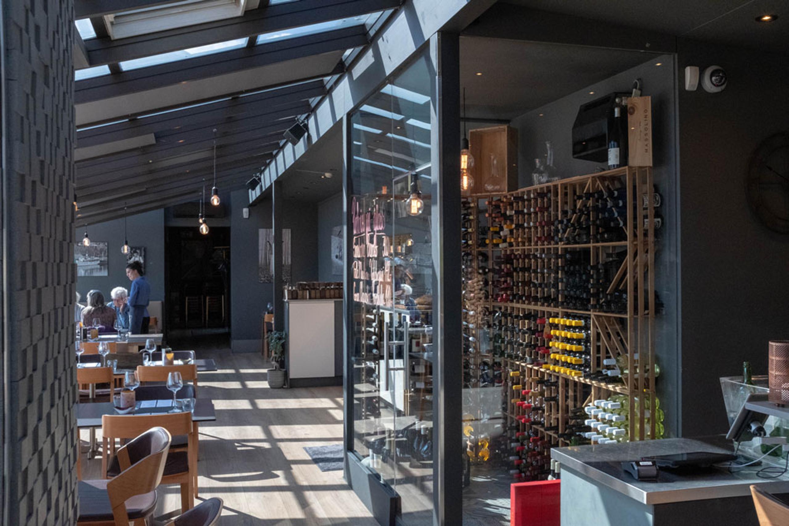 the restaurant with wine cabinet at Strøm mat & bar in Skien