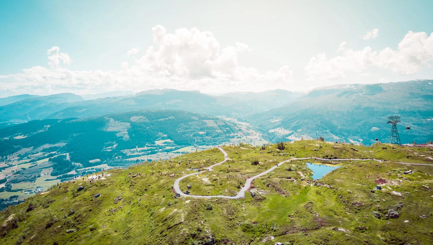 The top of mount Hangur, surrounded by open mountain terrain and panoramic views across the valley.