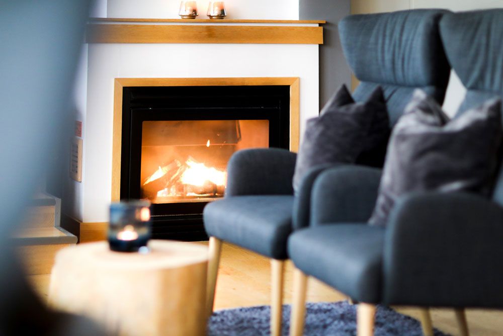 the fireplace in the lounge at the Home Hotel Bryggeparken