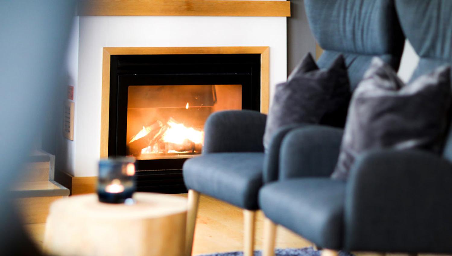 the fireplace in the lounge at the Home Hotel Bryggeparken