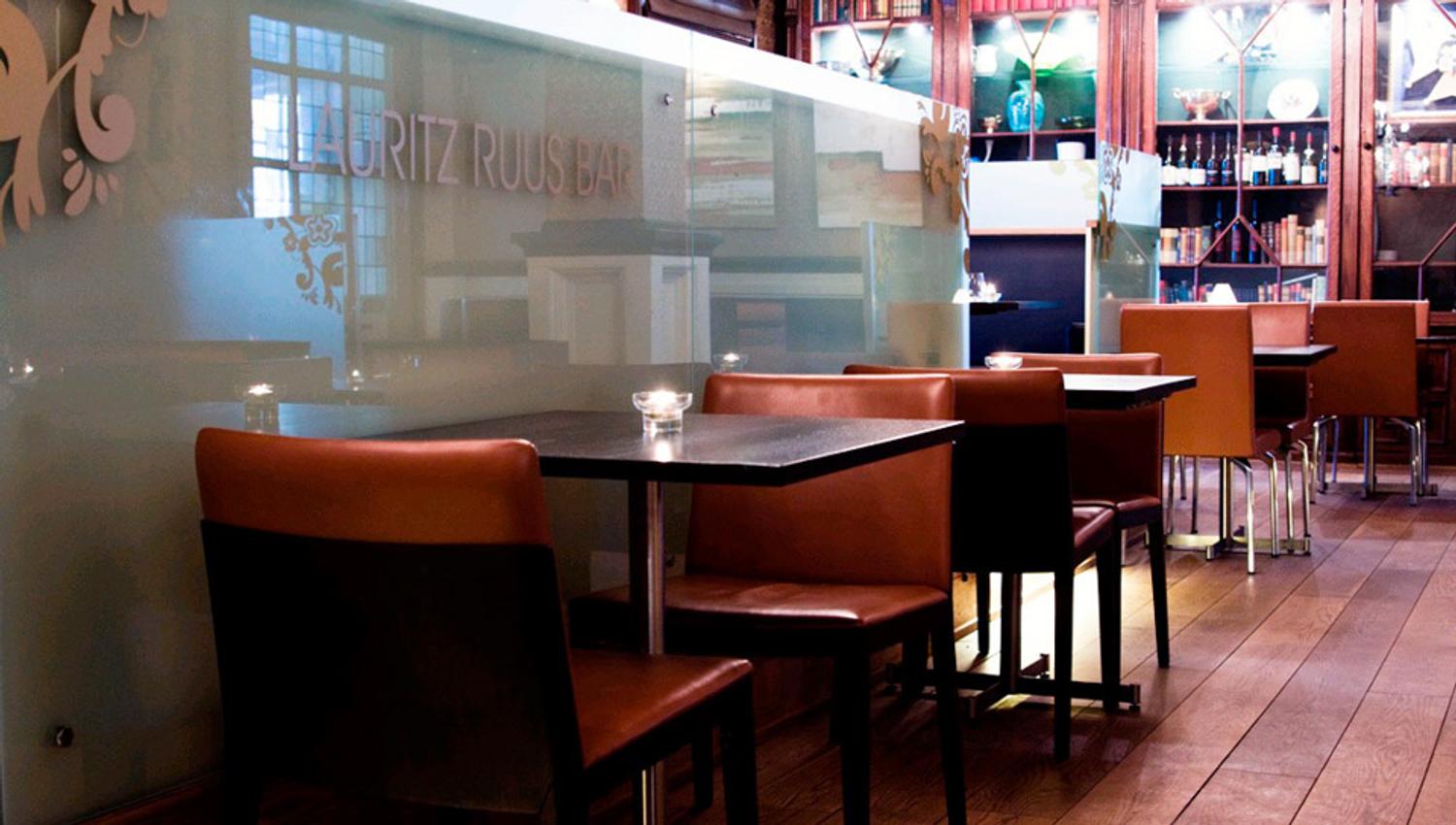 Various empty tables with chairs.