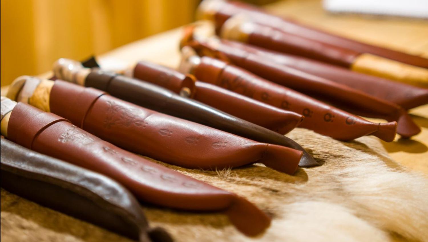Traditional Sami handicrafts and knives presented as part of a cultural experience in Tromsø.