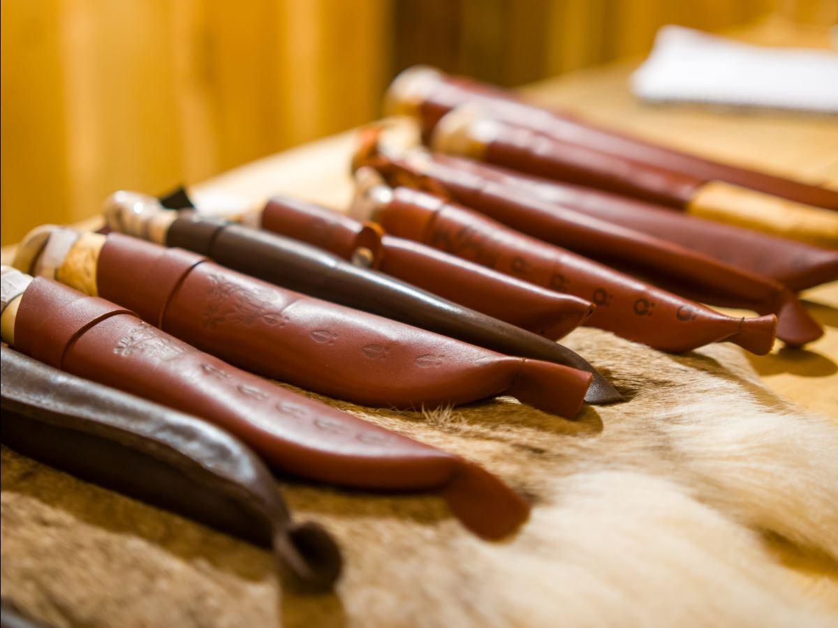 Traditional Sami handicrafts and knives presented as part of a cultural experience in Tromsø.