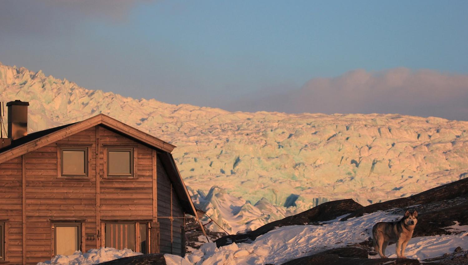 Nordenskiöld Lodge in the dusk lights with the Nordenskiöld Glacier in the background