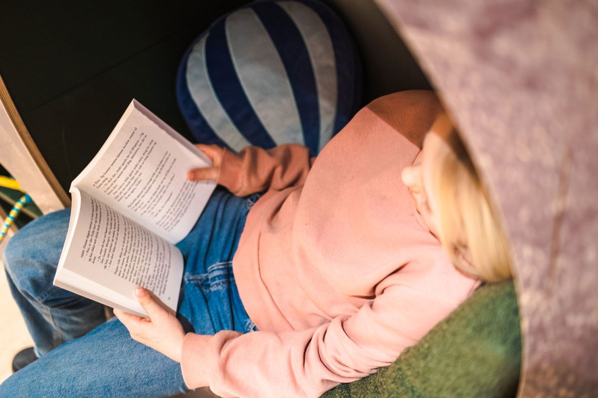 girl reading a book at the Vinje Center