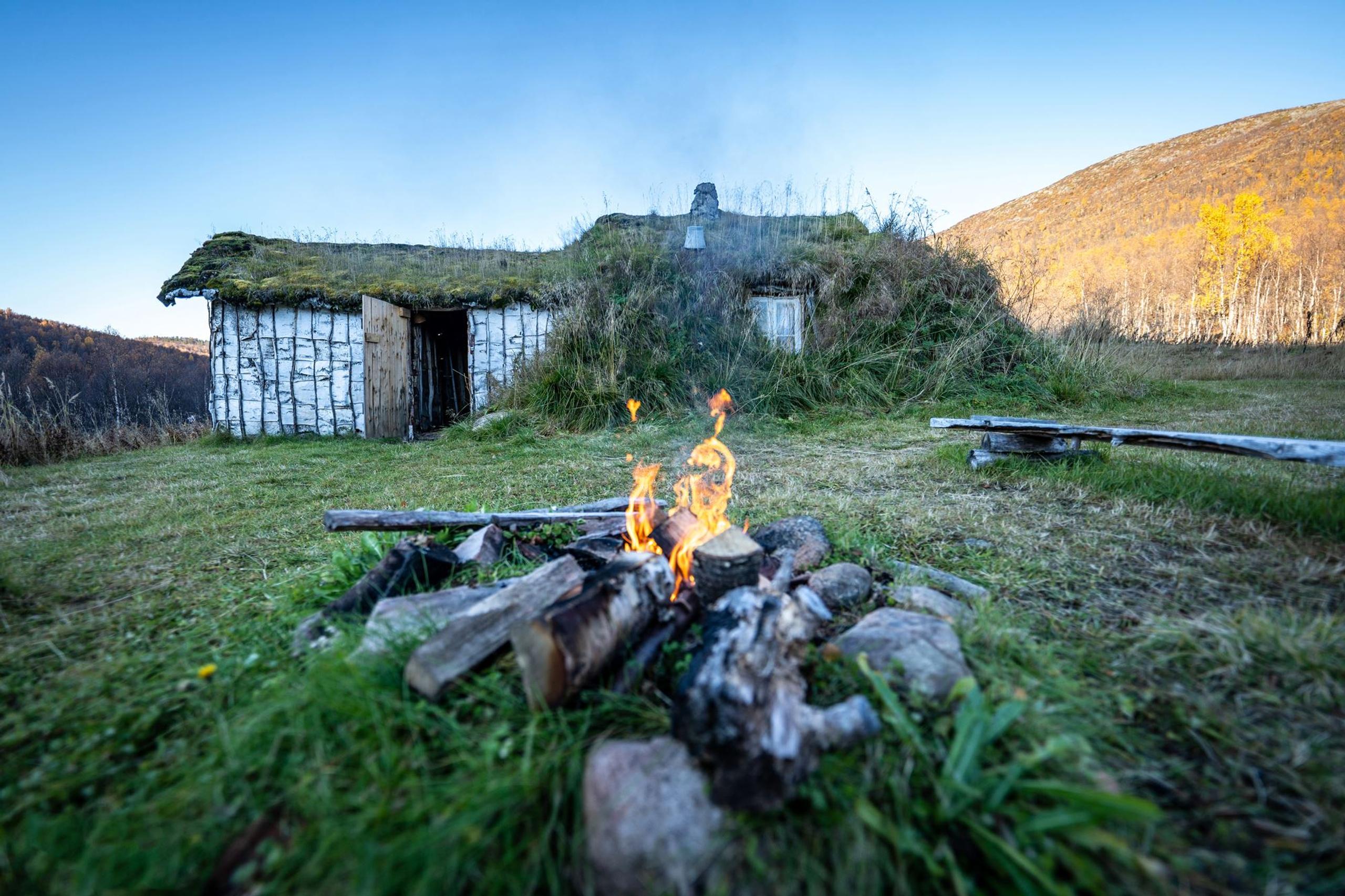 exterior of viking building, with a bonfire in front