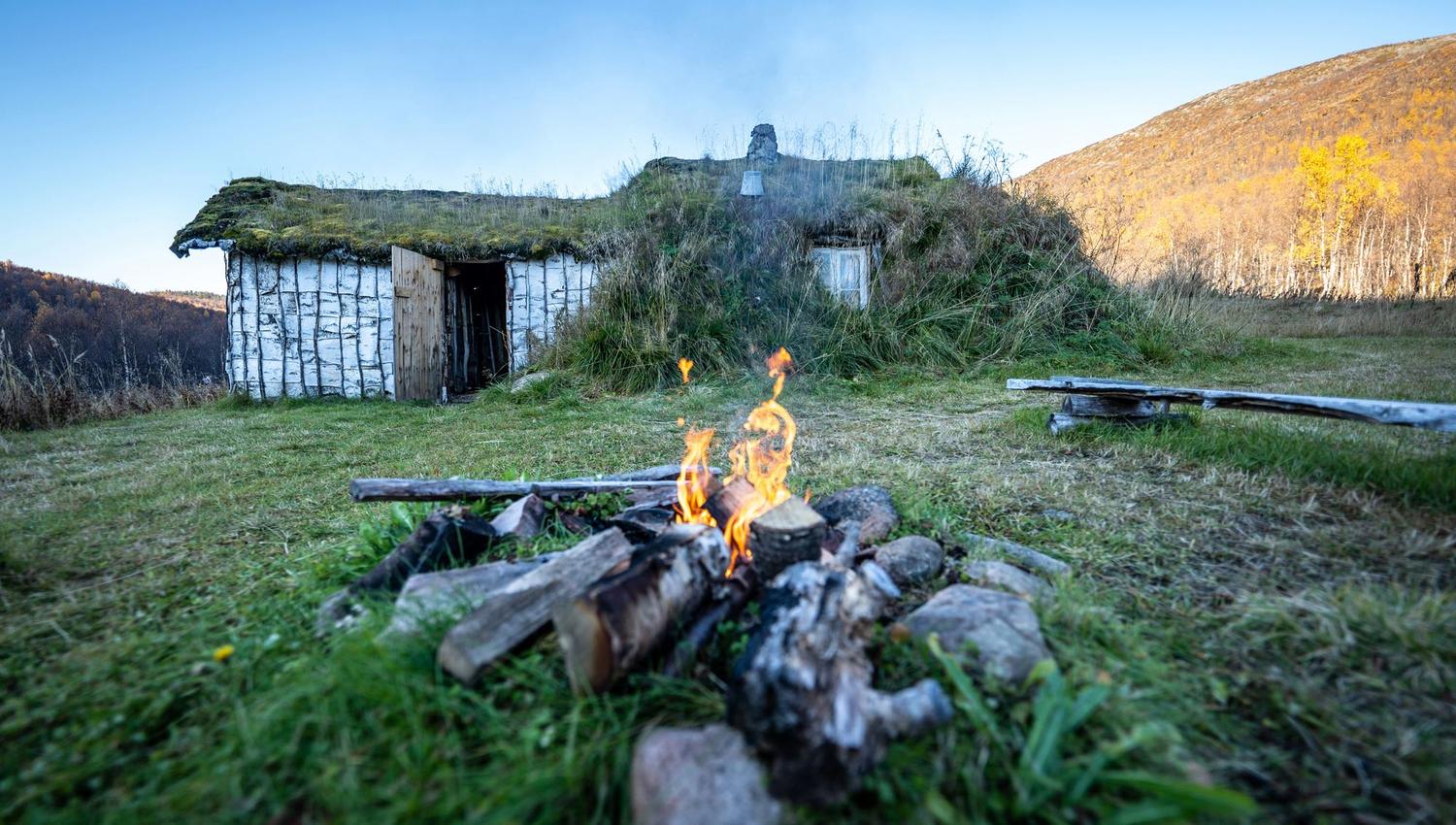 exterior of viking building, with a bonfire in front