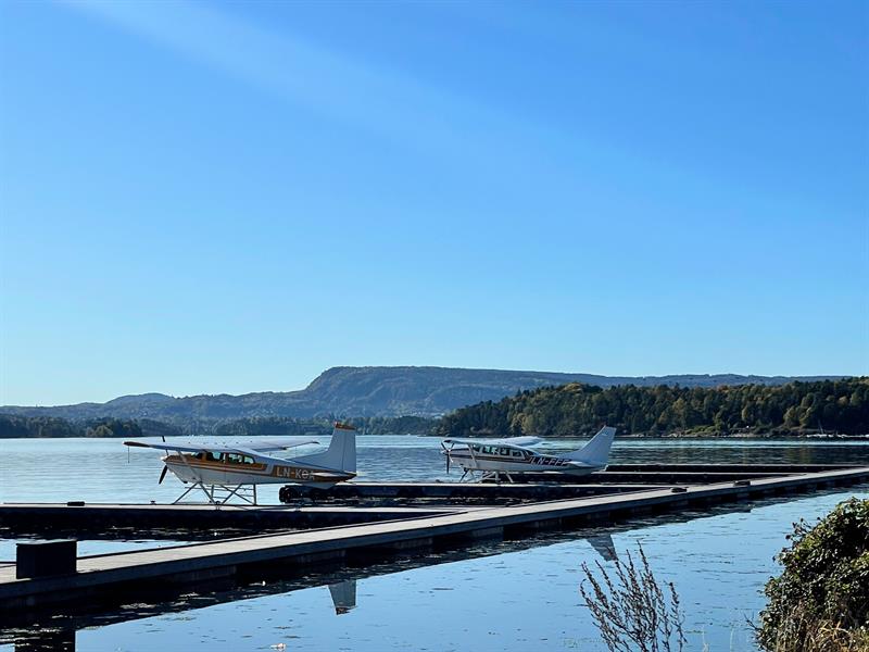 Two sea planes by the dock