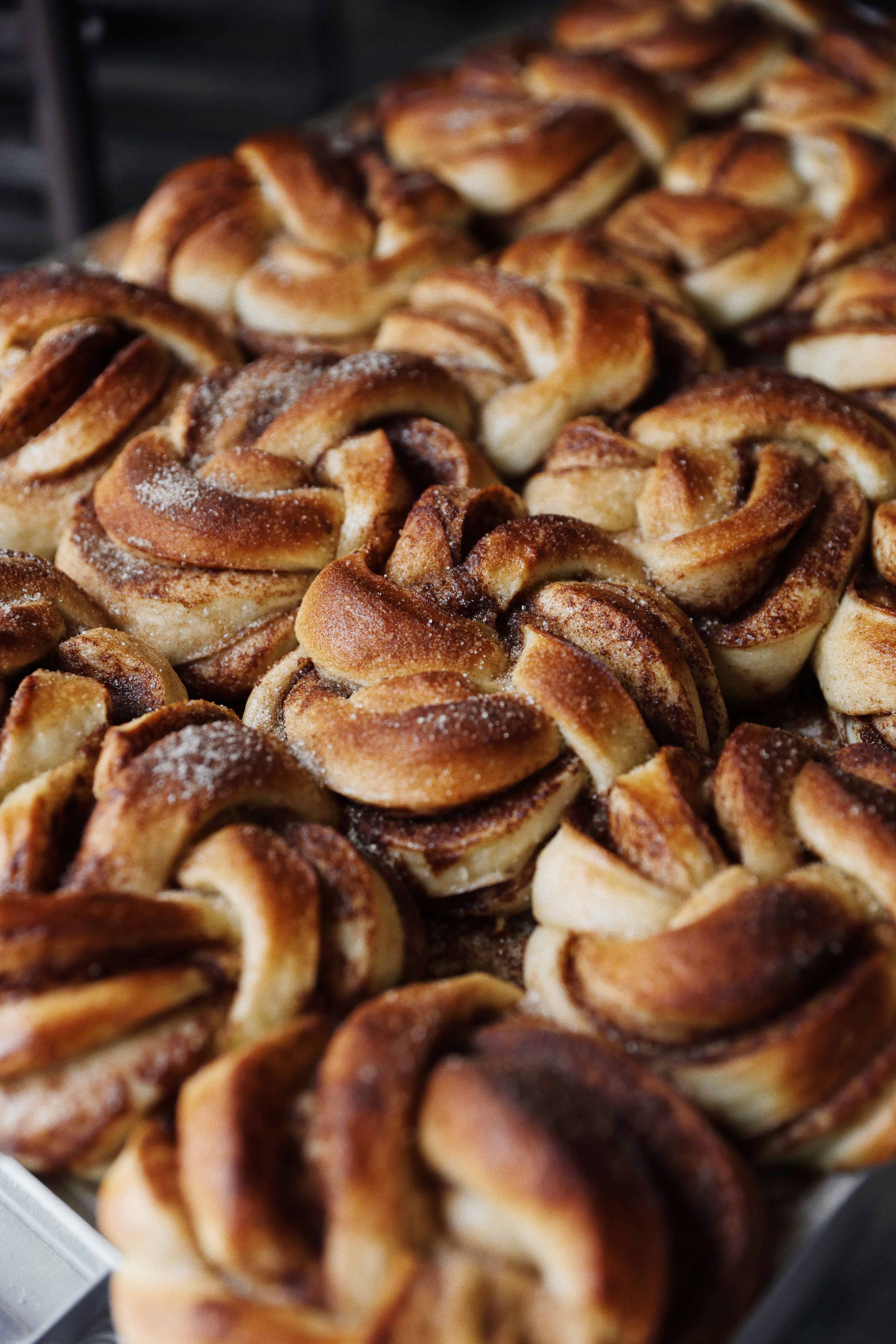 Close-up of warm cinnamon buns at Vik Restaurant, Bakeri & Kafé.