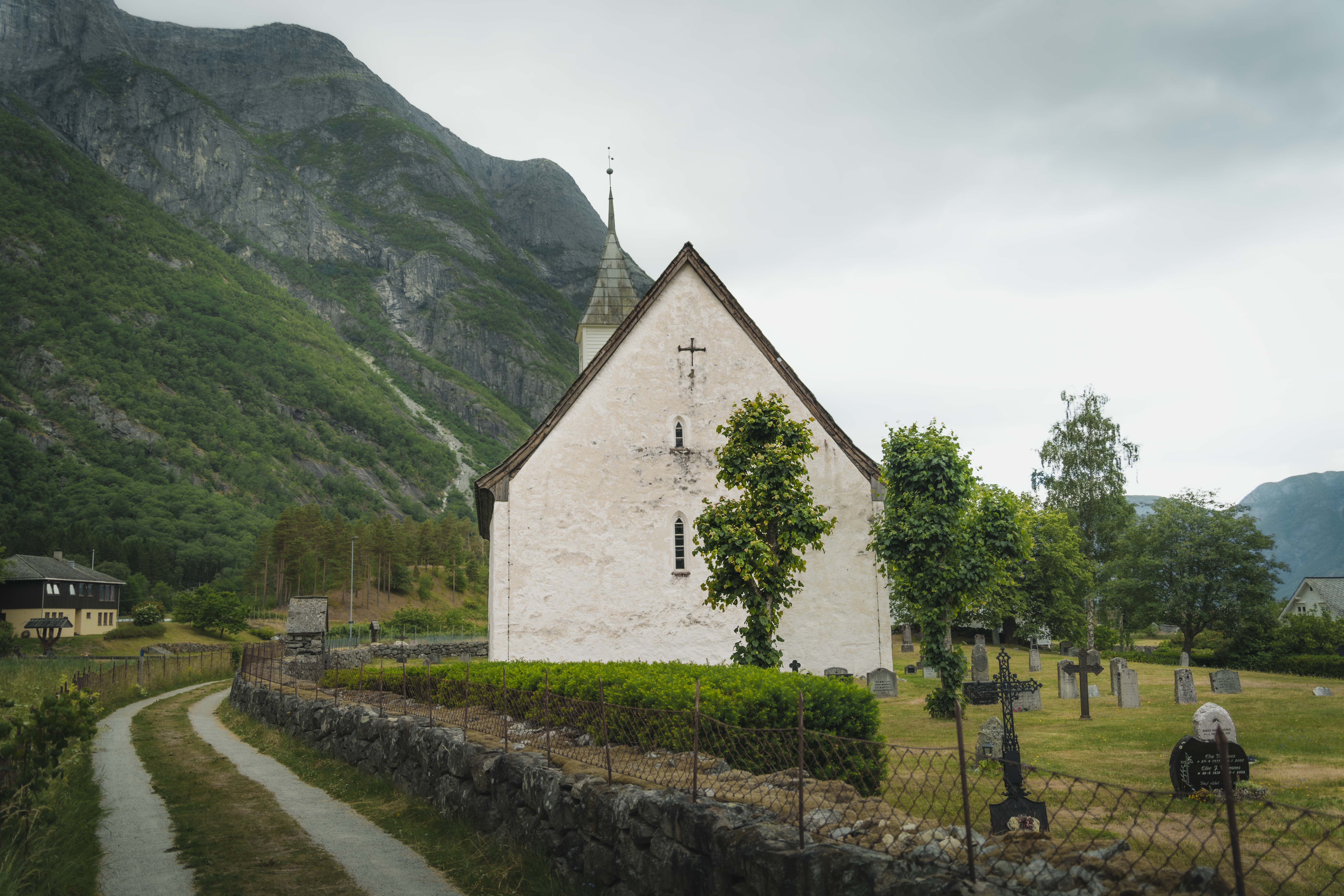 Showing the church and graveyard from behind the entrance.
