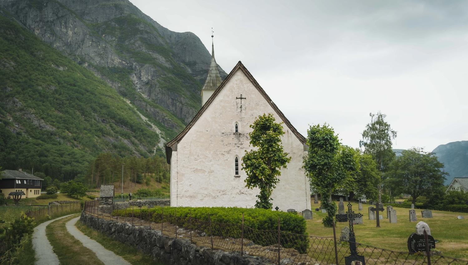 Showing the church and graveyard from behind the entrance.