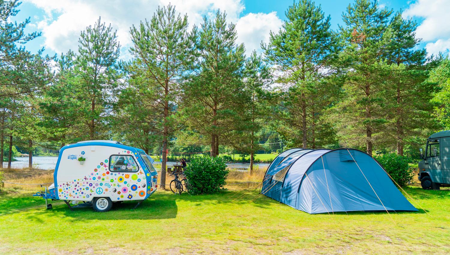A small, cute floral caravan and a tent