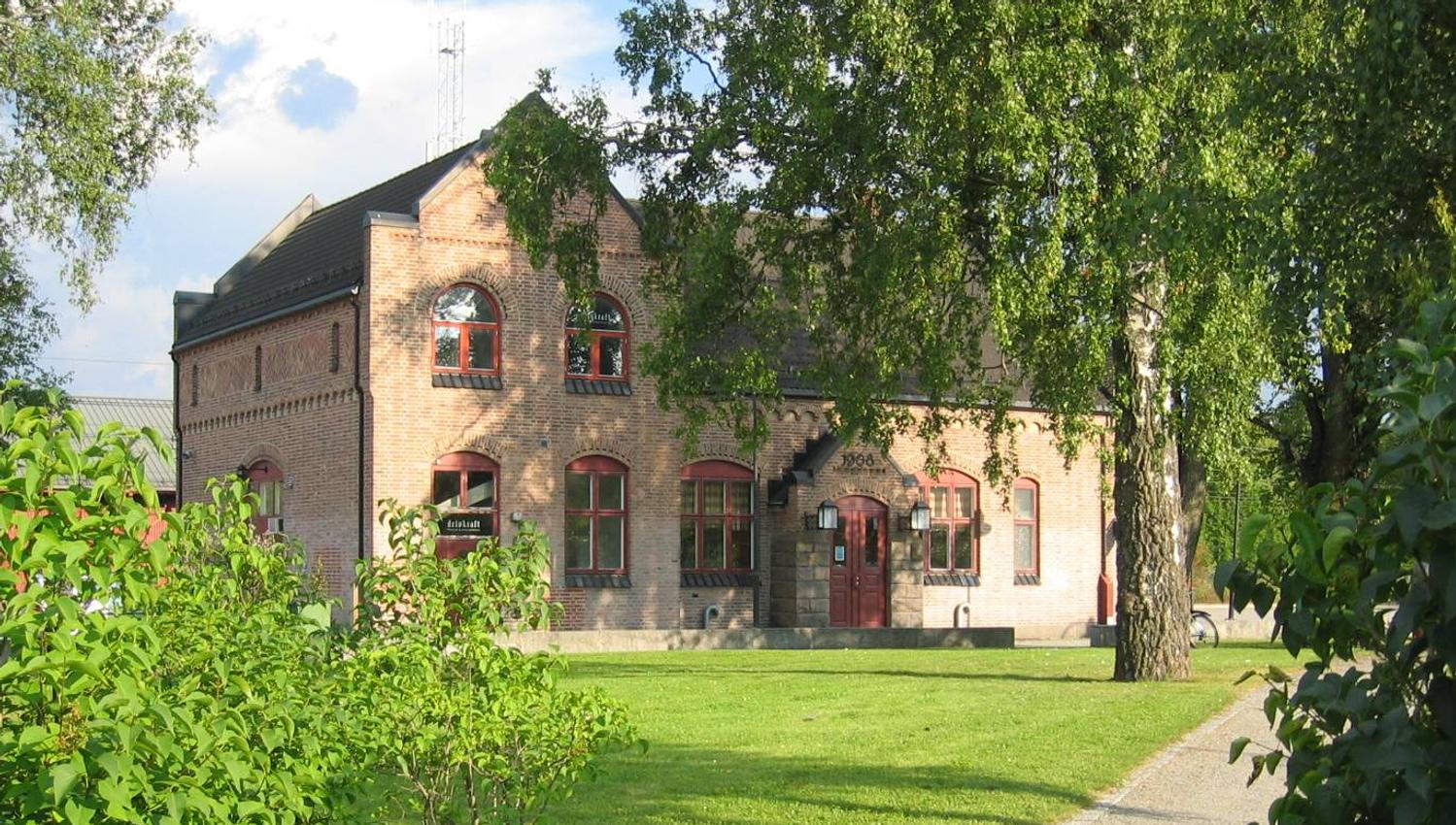 Brick building with many windows.