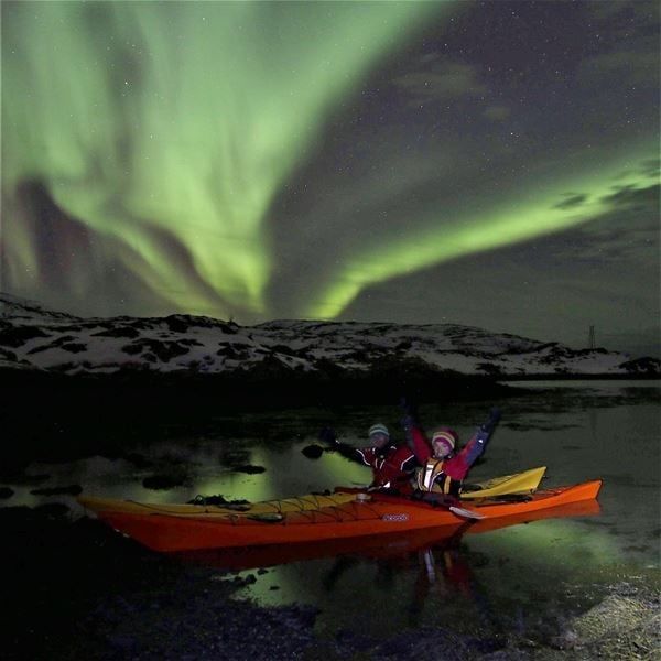 Kayaks under the northern lights