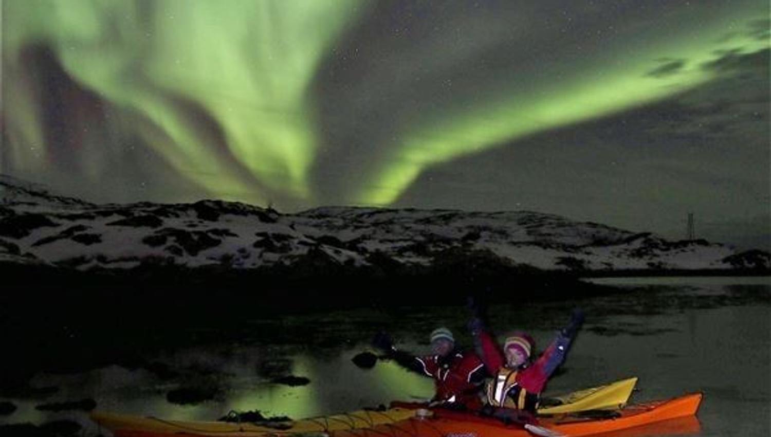 Kayaks under the northern lights