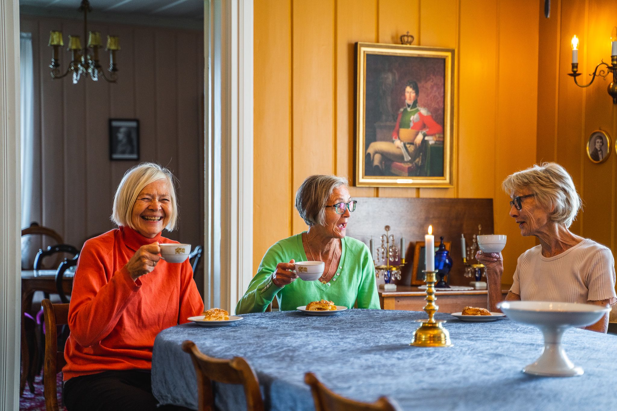 three women drinking coffee
