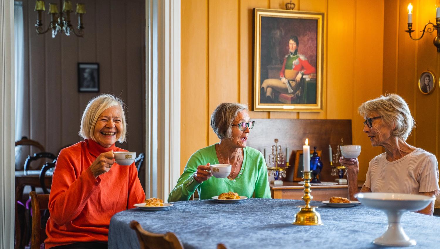 three women drinking coffee