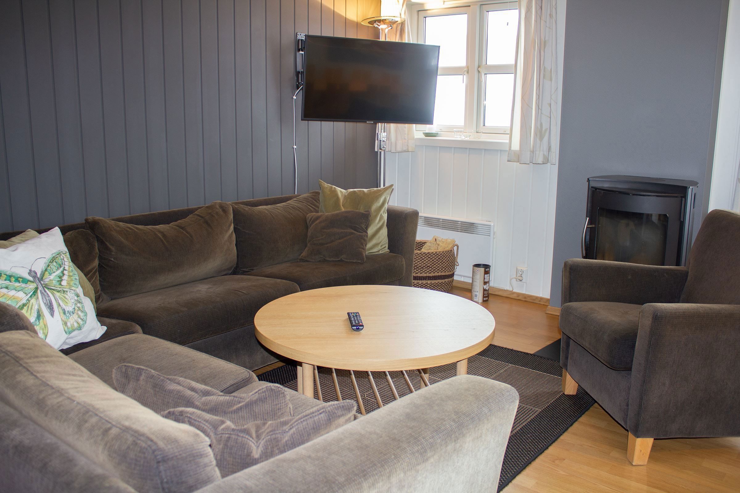 A living room with sofa and TV.