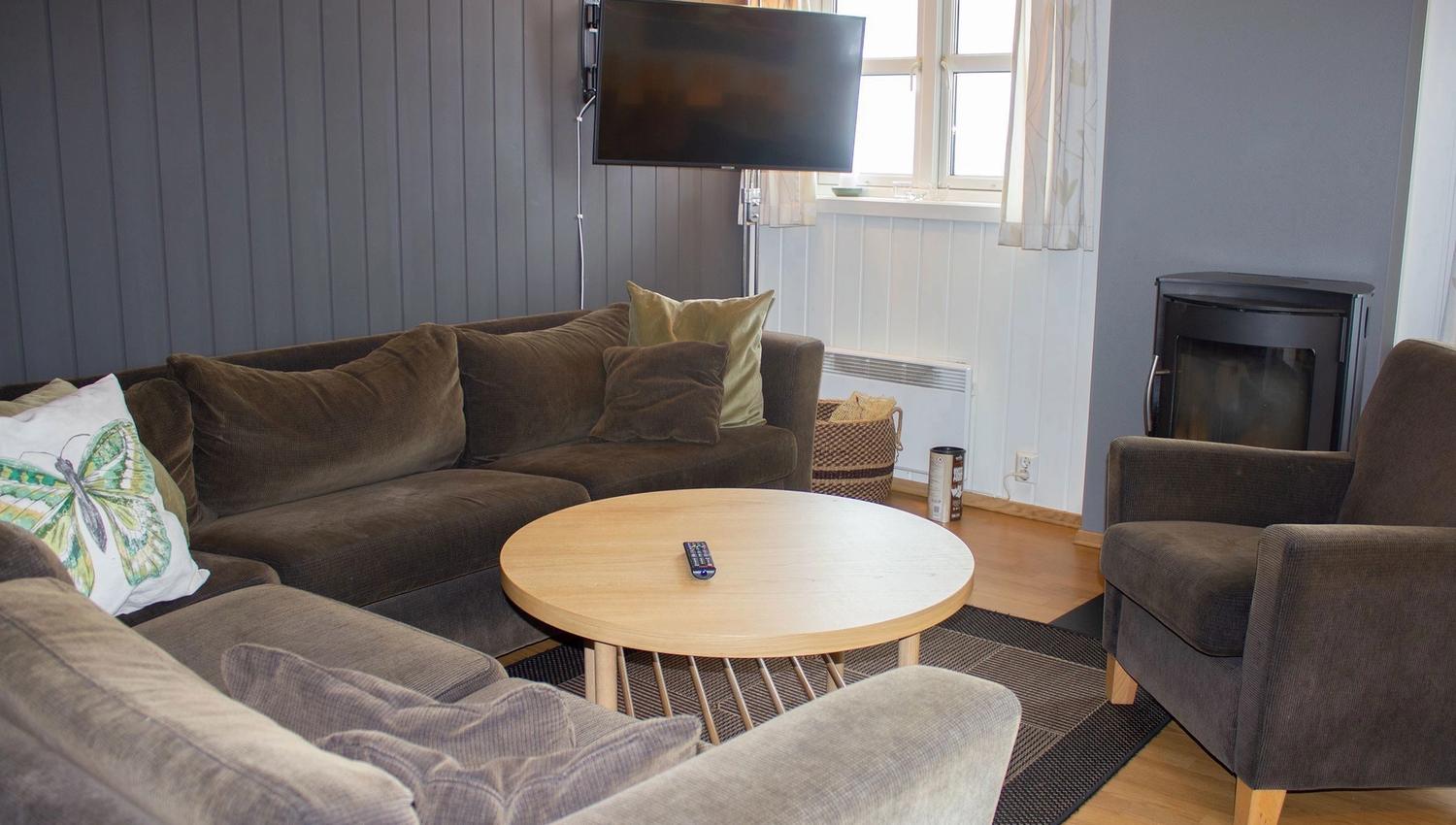 A living room with sofa and TV.