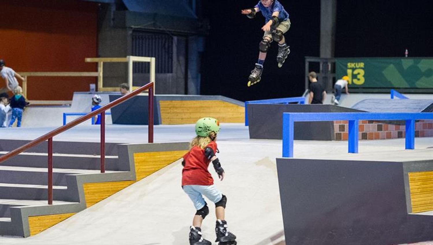 children on roller skates indoors