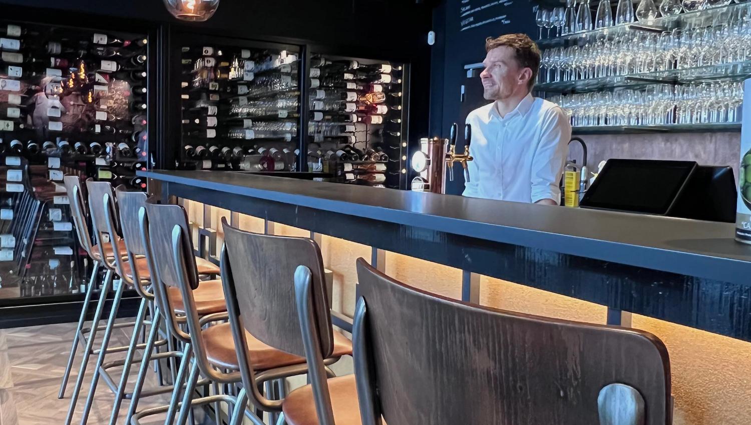 Bartender behind the bar
