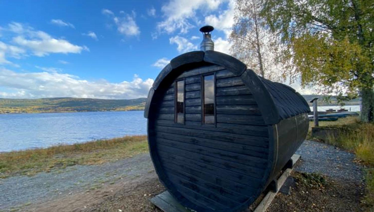 Barrel sauna utside by the lake